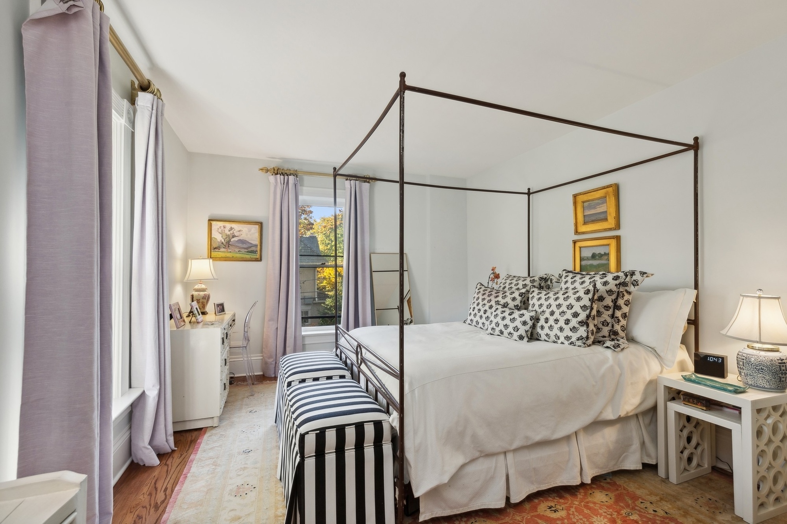 666 Maple Avenue Lake Bluff, IL 60044 - Photo 21 of 41 a bedroom with a bed and a chandelier