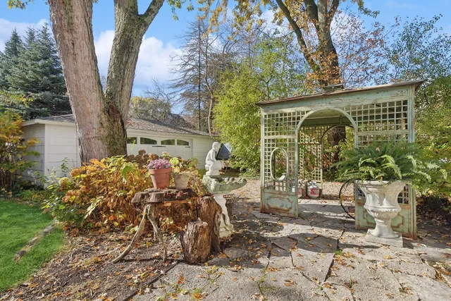 a view of a patio with table and chairs and potted plants