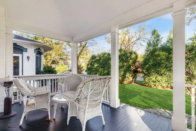 a view of balcony with furniture and garden