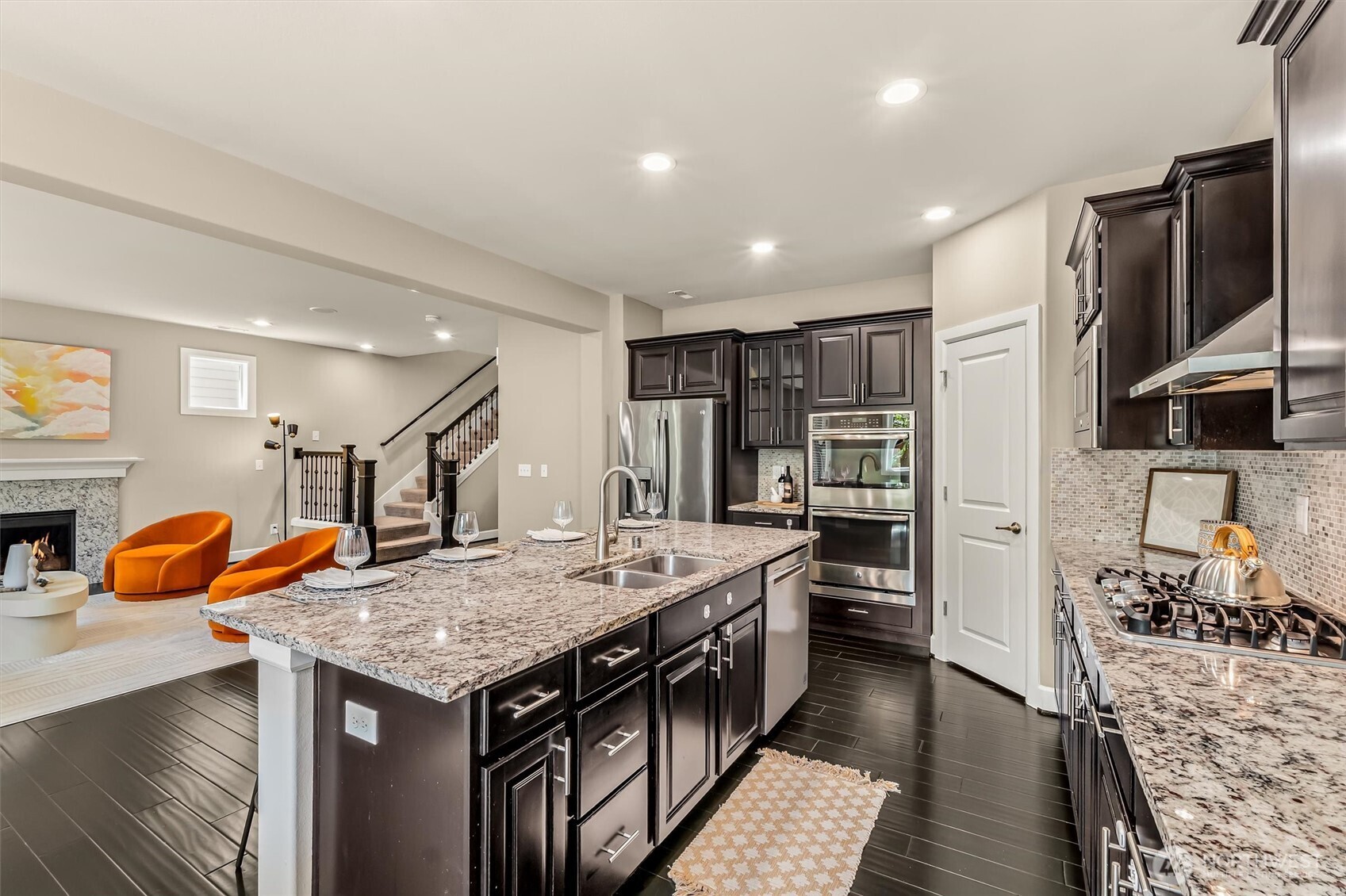 4114 174th Street Southeast Bothell, WA 98012 - Photo 12 of 40 a kitchen with stainless steel appliances granite countertop a stove oven and a refrigerator