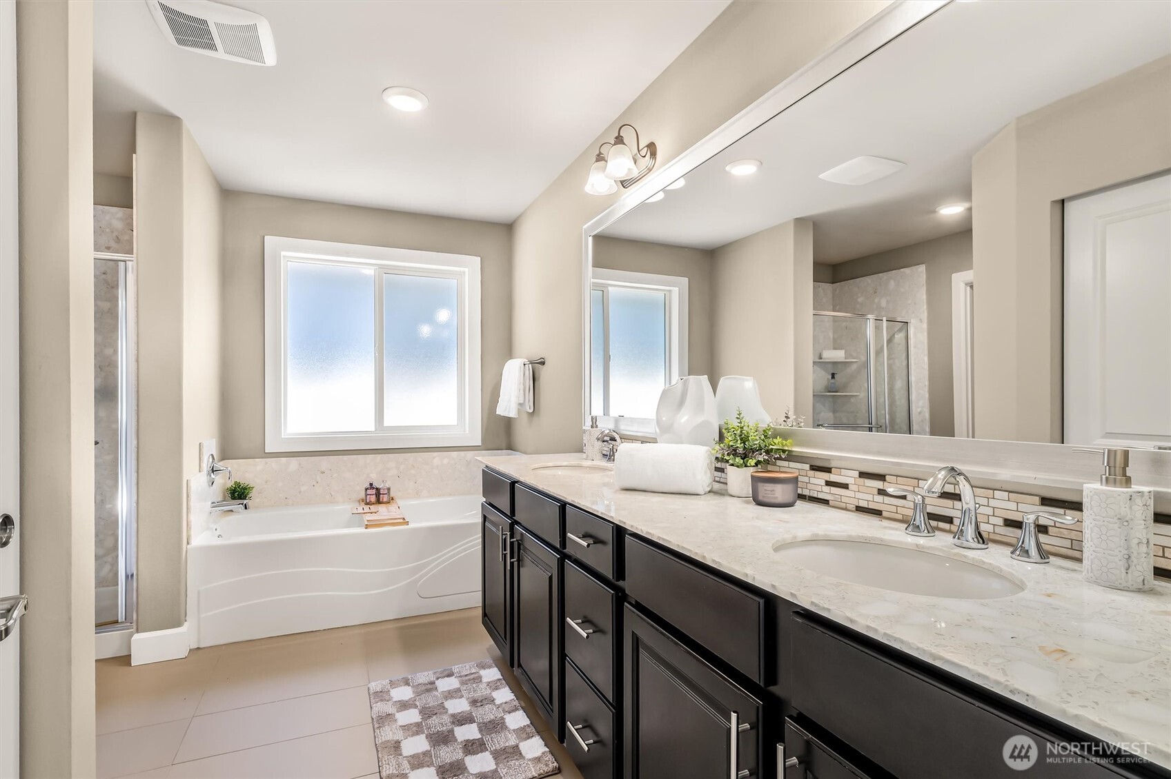 4114 174th Street Southeast Bothell, WA 98012 - Photo 23 of 40 a spacious bathroom with a tub sink and mirror