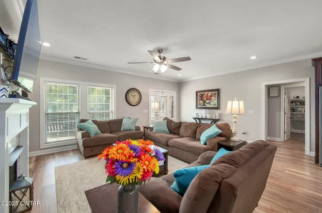 a dining area with stainless steel appliances kitchen island granite countertop a dining table chairs and granite counter tops