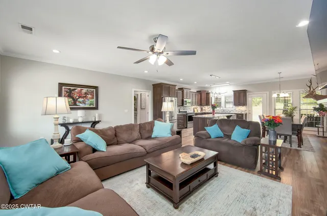 a kitchen with granite countertop a counter space stainless steel appliances and cabinets