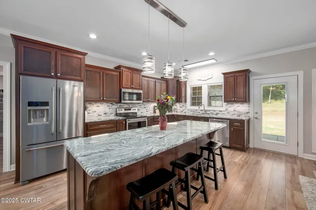 a room with a bed and a dresser