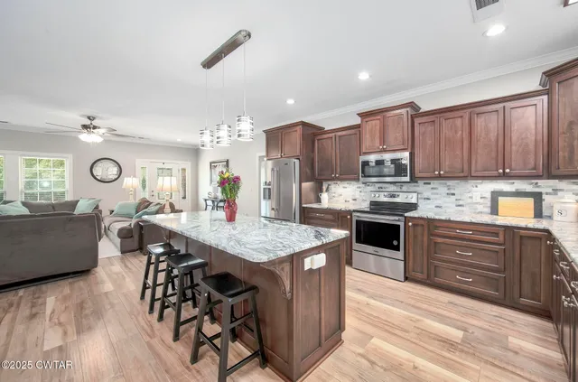 a bath tub sitting in a bathroom next to a window