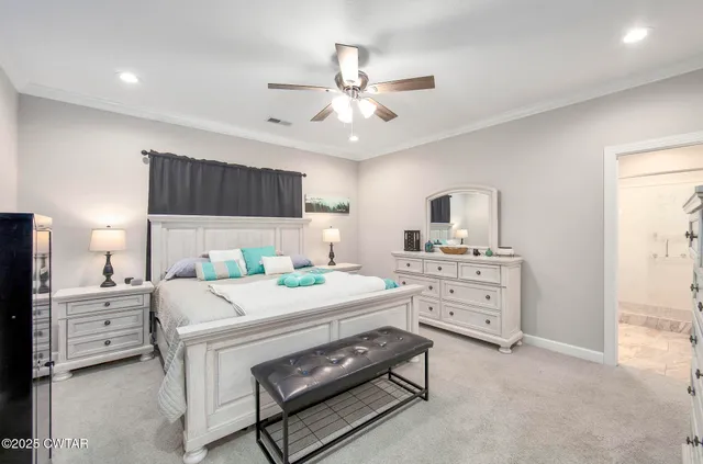 a spacious bathroom with a shower a sink and a mirror