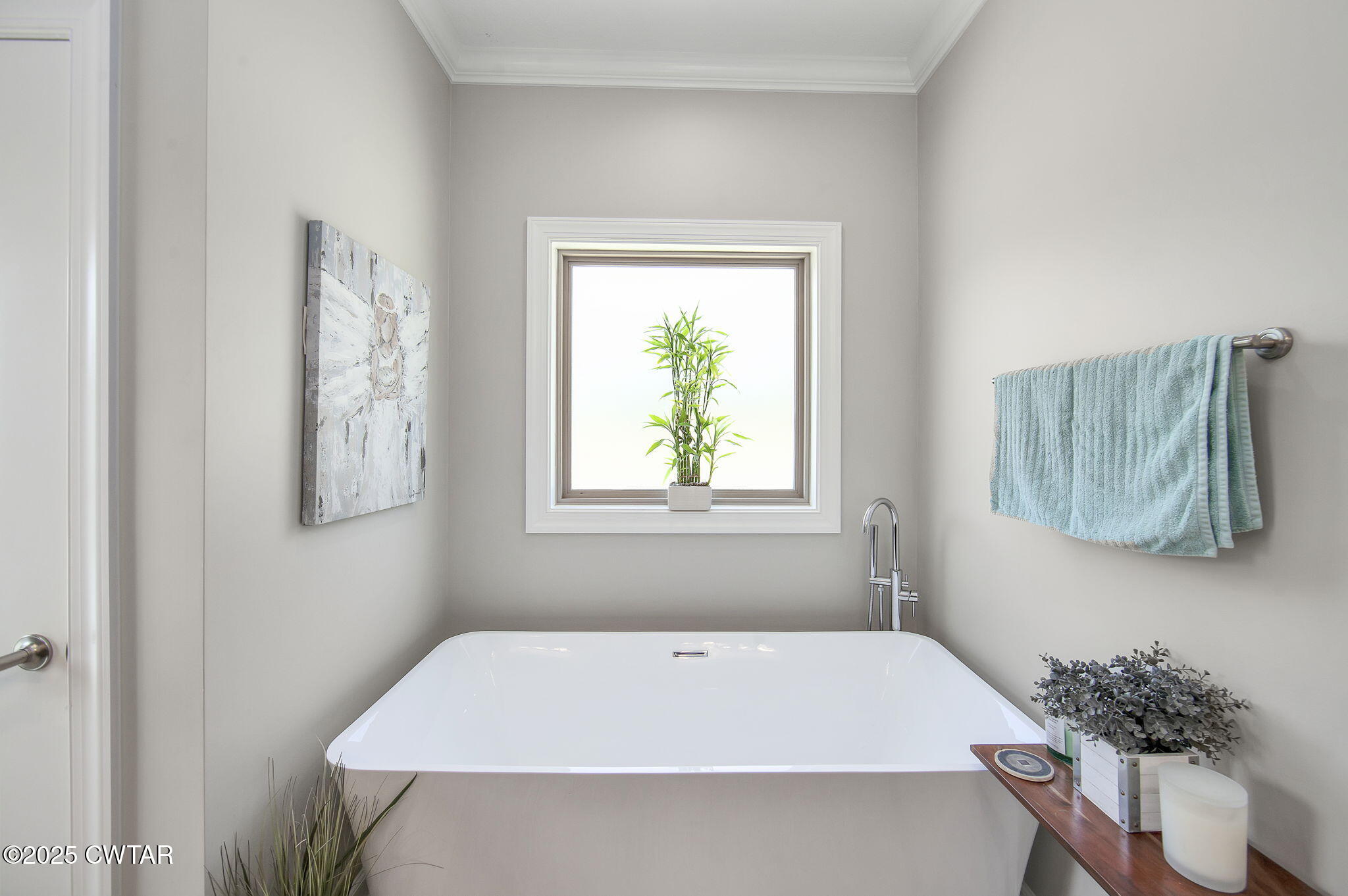 240 Greystone Cv Street Henderson, TN 38340 - Photo 22 of 64 a bath tub sitting in a bathroom next to a window