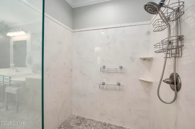 a bathroom with a toilet a sink and a mirror