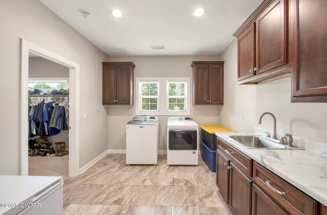 a bathroom with a sink vanity granite and toilet