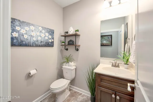 a view of a livingroom with furniture and windows in a room