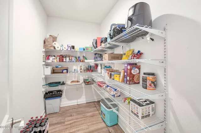 a view of a balcony with chair and table in the patio