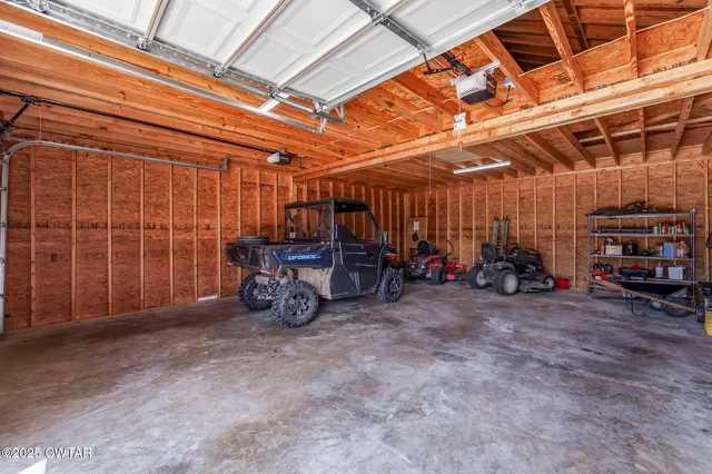 a view of a swimming pool with a yard and a garden
