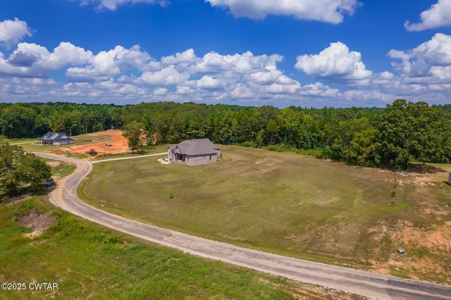 an aerial view of a house with a garden
