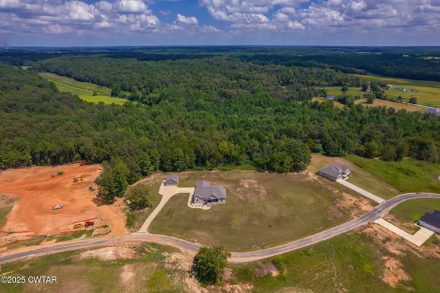 a view of a park with swings and slides