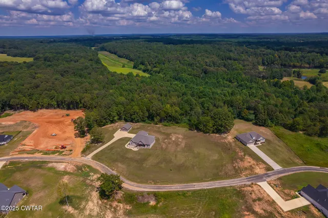a view of a backyard with sitting area