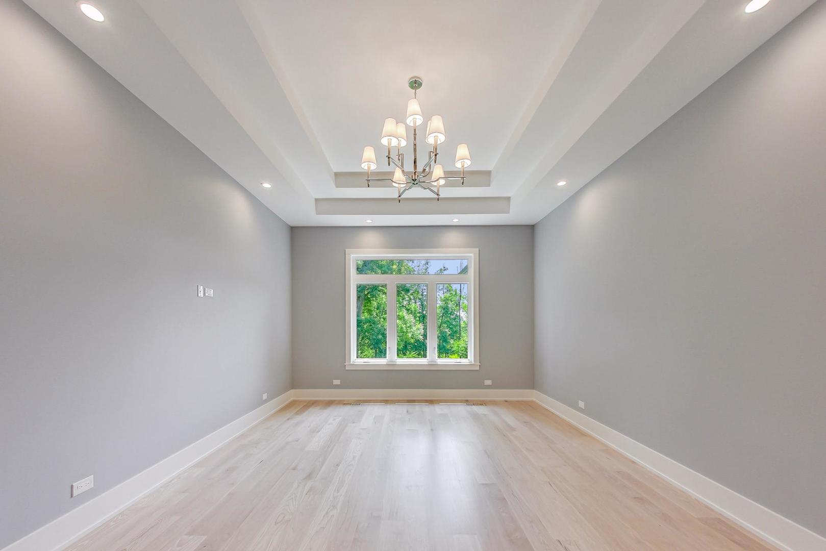 1519 Linden Circle Lemont, IL 60439 - Photo 25 of 84 a view of an empty room with wooden floor and a window