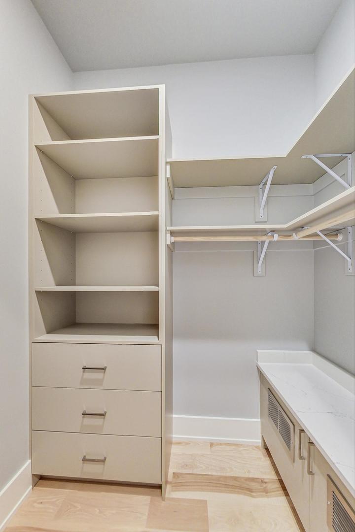 1519 Linden Circle Lemont, IL 60439 - Photo 29 of 84 a view of walk in closet with empty racks