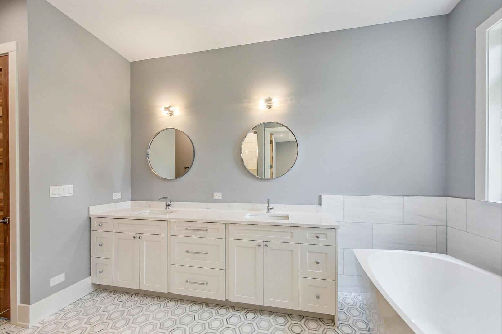1519 Linden Circle Lemont, IL 60439 - Photo 30 of 84 a spacious bathroom with a double vanity sink double mirror and bathtub