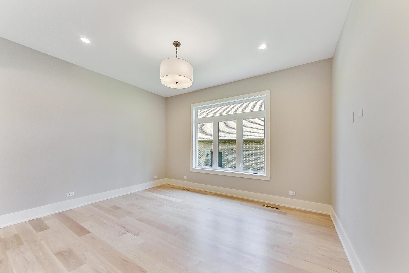 1519 Linden Circle Lemont, IL 60439 - Photo 34 of 84 an empty room with wooden floor and windows
