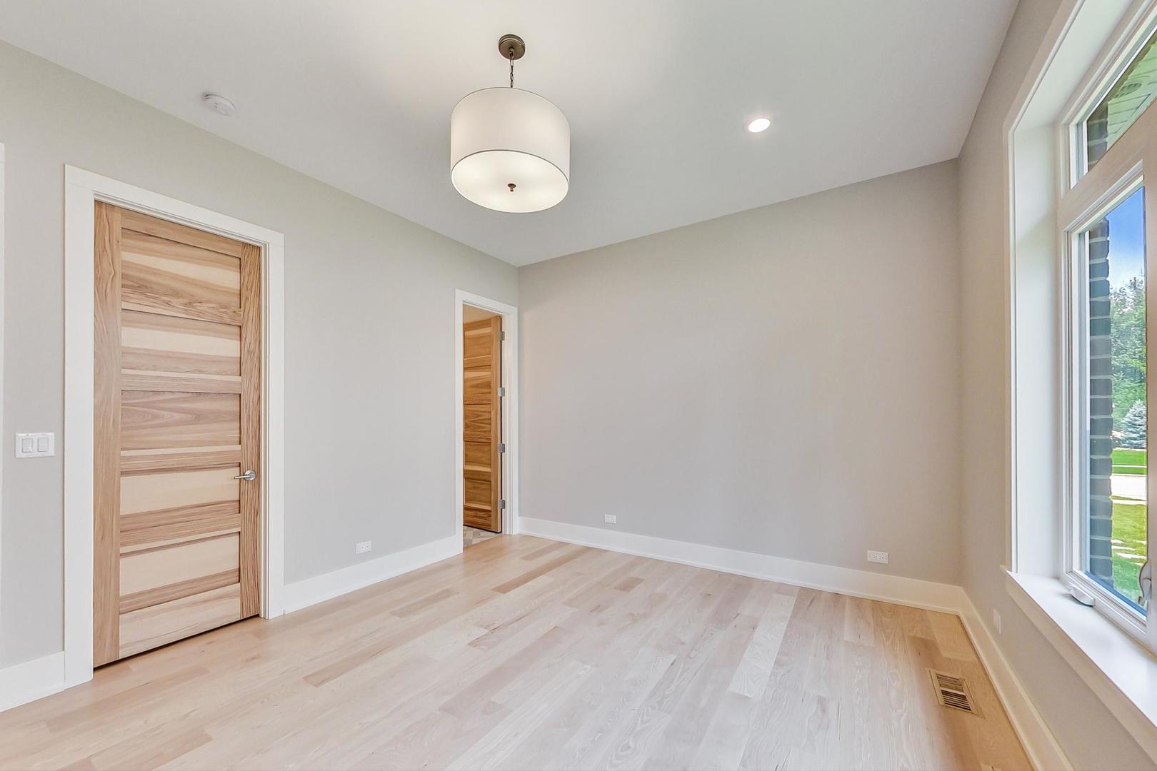 1519 Linden Circle Lemont, IL 60439 - Photo 35 of 84 an empty room with wooden floor and window