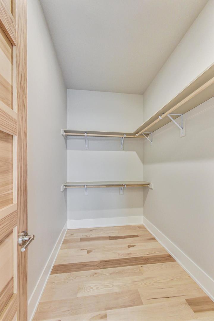 1519 Linden Circle Lemont, IL 60439 - Photo 37 of 84 a view of walk in closet with empty racks