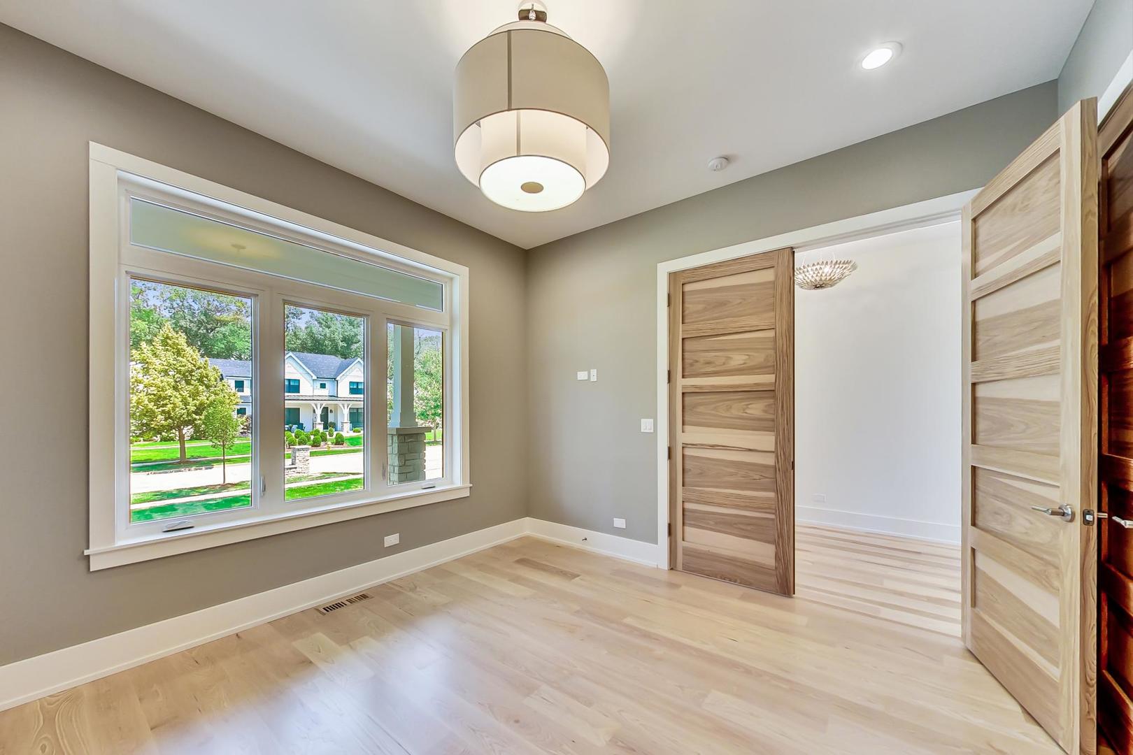 1519 Linden Circle Lemont, IL 60439 - Photo 41 of 84 an empty room with wooden floor and windows