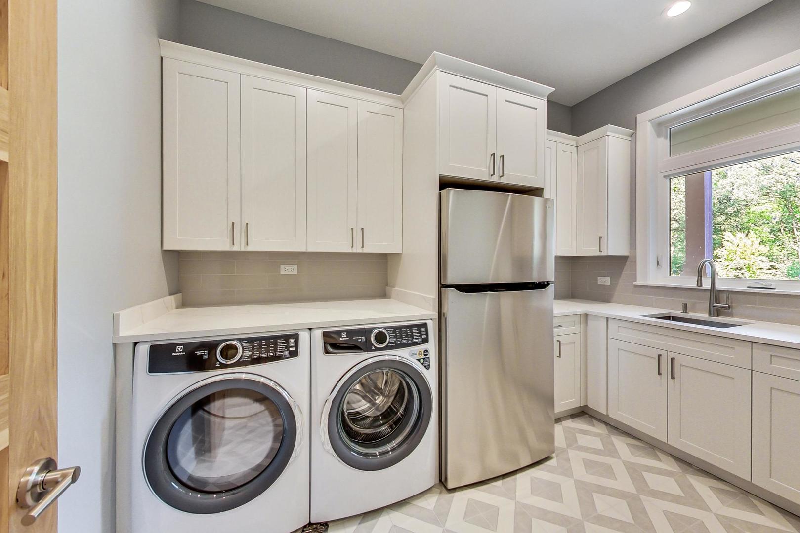 1519 Linden Circle Lemont, IL 60439 - Photo 44 of 84 a kitchen with a refrigerator sink and cabinets