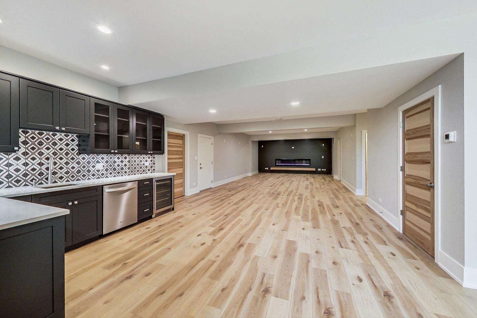 1519 Linden Circle Lemont, IL 60439 - Photo 55 of 84 a large kitchen with a sink and stove top oven