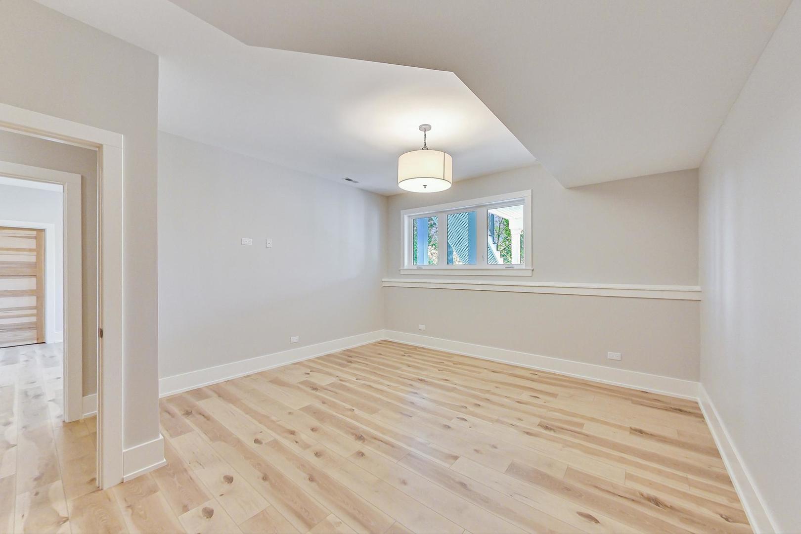1519 Linden Circle Lemont, IL 60439 - Photo 59 of 84 an empty room with wooden floor and windows