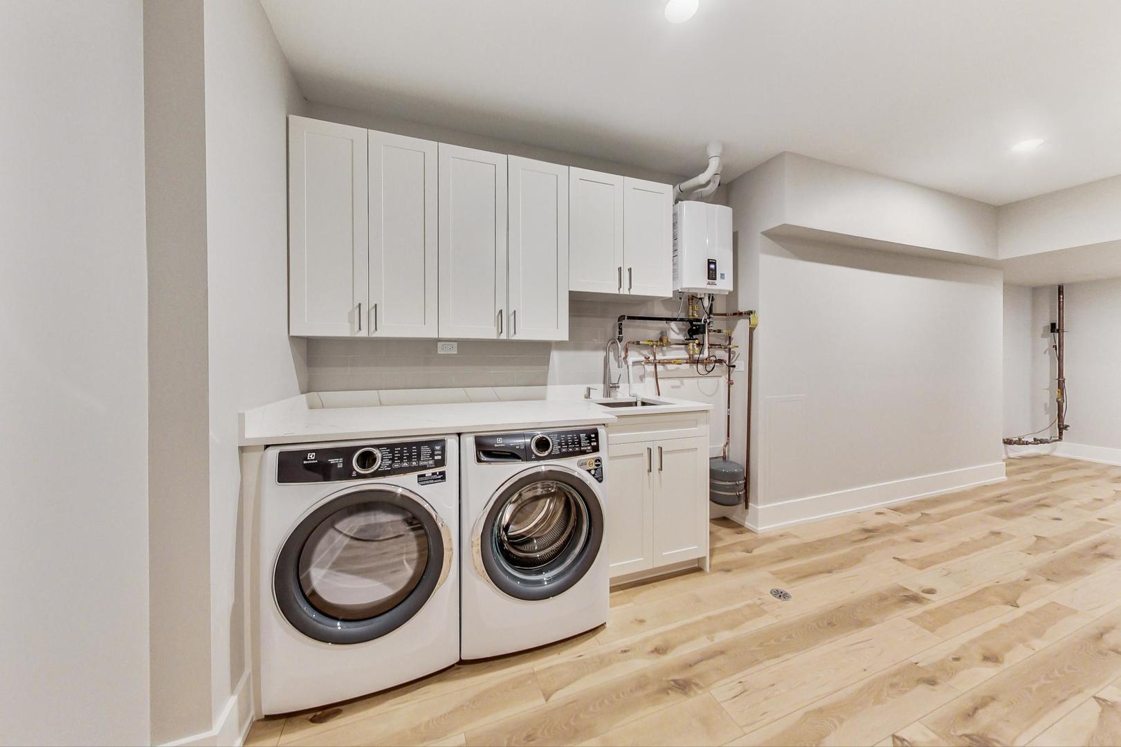 1519 Linden Circle Lemont, IL 60439 - Photo 66 of 84 a utility room with sink dryer and washer