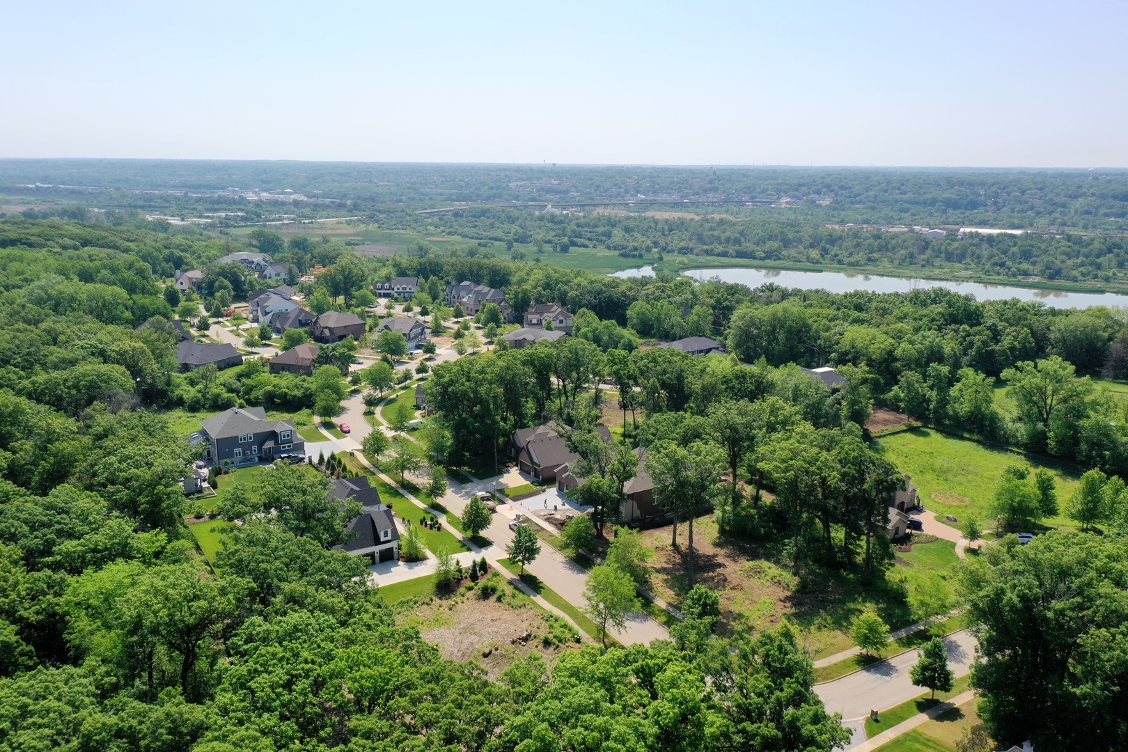 1519 Linden Circle Lemont, IL 60439 - Photo 81 of 84 an aerial view of green landscape with trees houses and mountain view