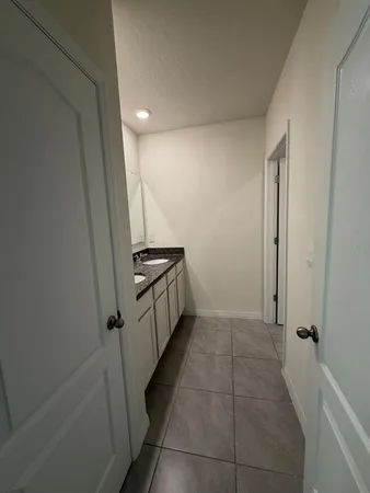 a view of an empty room and a window