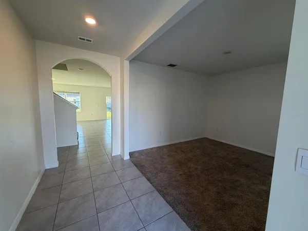 an empty room with a empty space and window