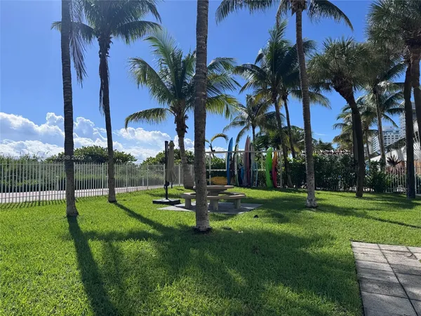 a view of a park with swings and slides