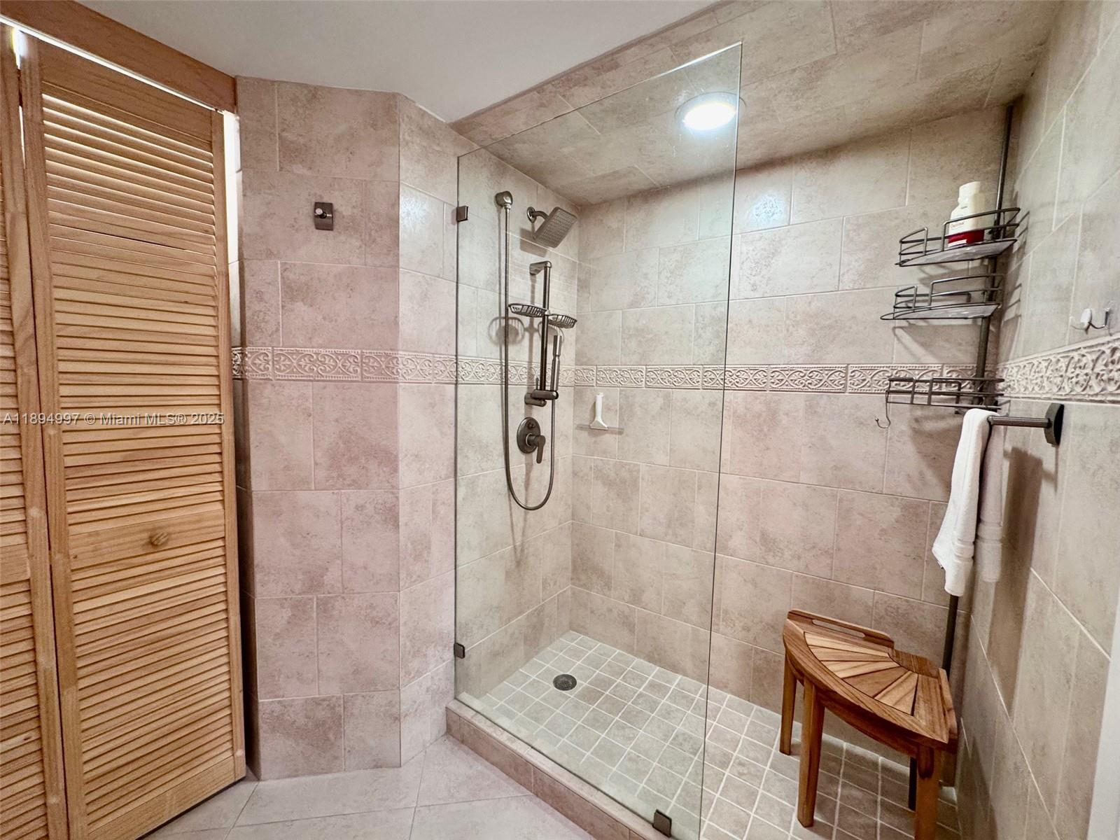 6061 Collins Avenue, Unit 10C Miami Beach, FL 33140 - Photo 42 of 45 a bathroom with a shower