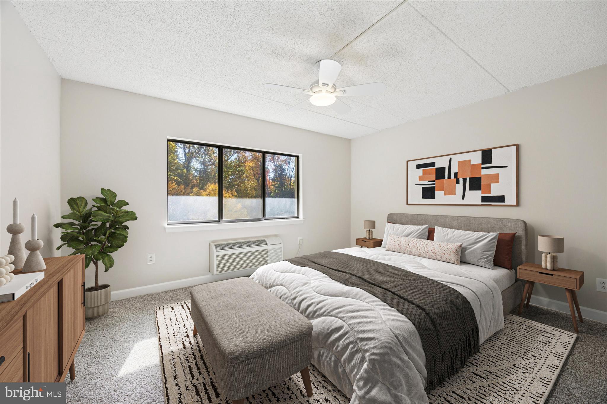 800 Avondale Road, Unit 7B Wallingford, PA 19086 - Photo 13 of 24 a bedroom with a bed and a potted plant