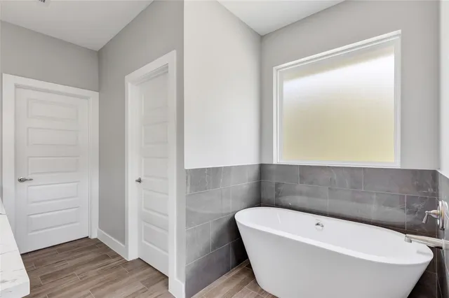 a bathroom with a white bath tub