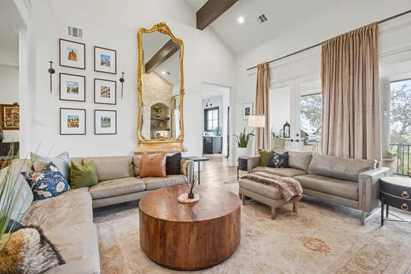 a living room with furniture and a large window