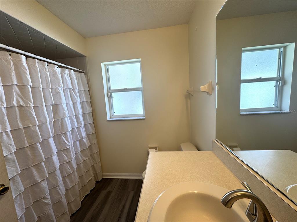 54 Westmount Lane Palm Coast, FL 32164 - Photo 12 of 32 a bedroom with a bed and a window