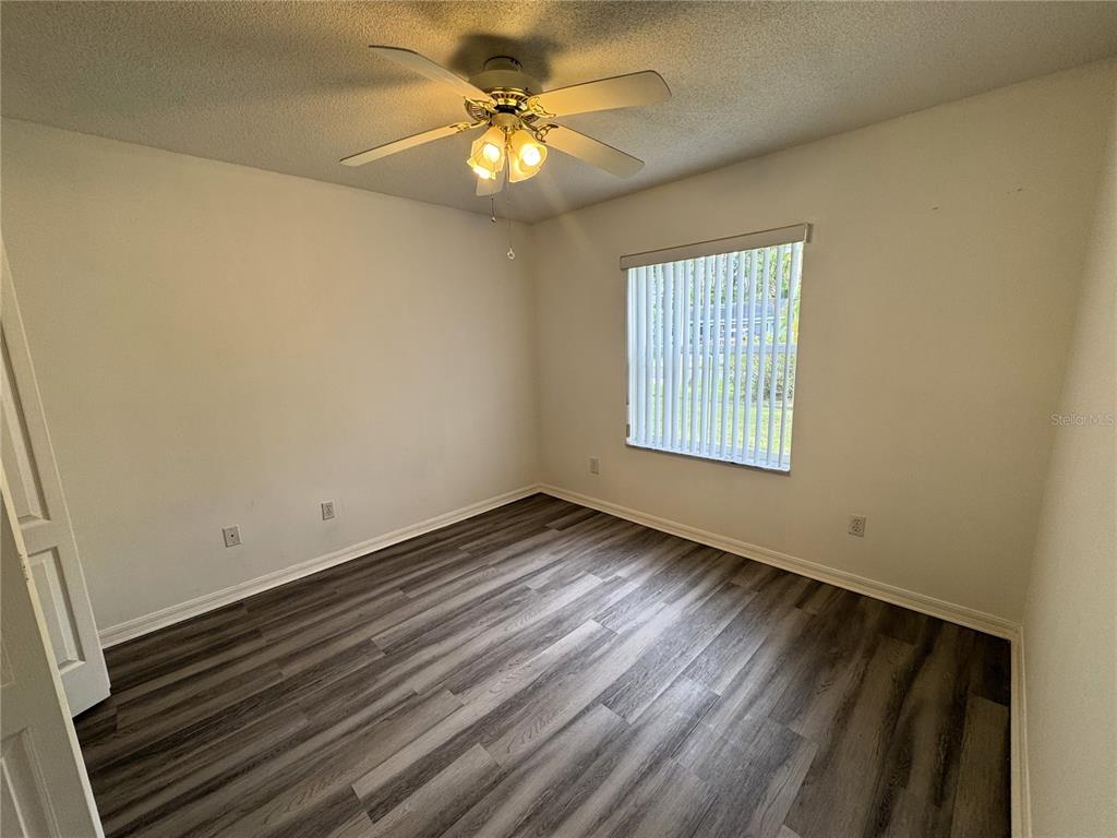 54 Westmount Lane Palm Coast, FL 32164 - Photo 13 of 32 an empty room with windows