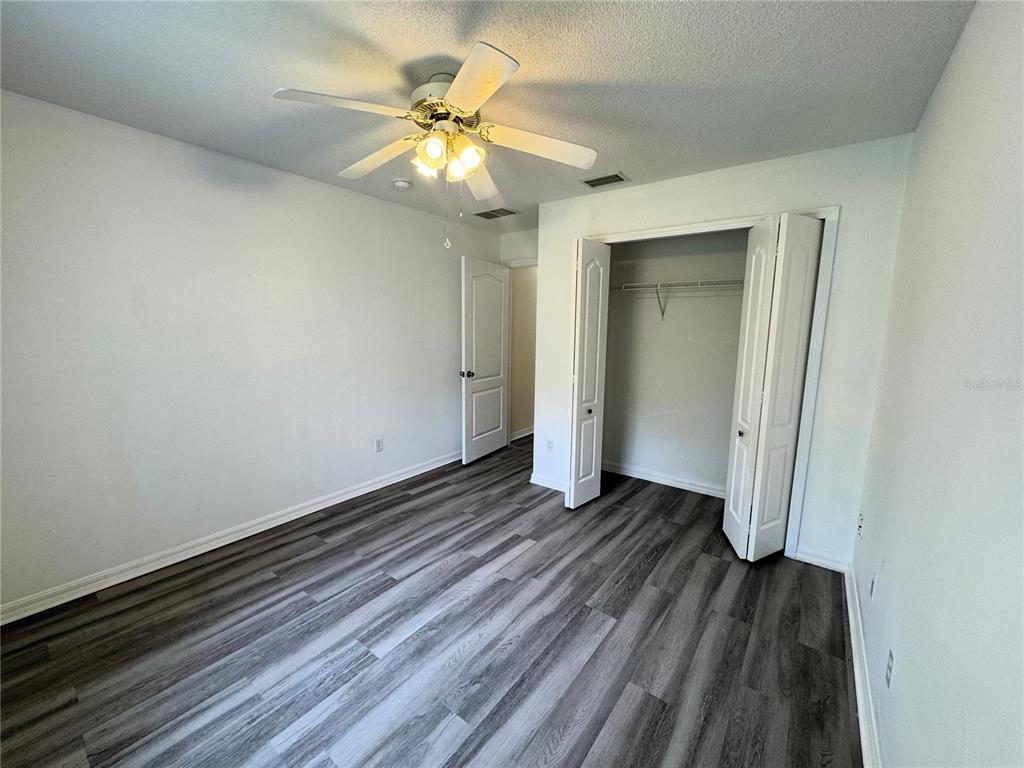 54 Westmount Lane Palm Coast, FL 32164 - Photo 14 of 32 a view of an empty room with wooden floor