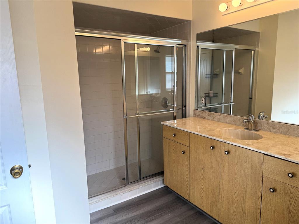 54 Westmount Lane Palm Coast, FL 32164 - Photo 24 of 32 a bathroom with a double vanity sink and a mirror