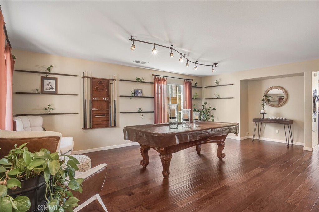 4330 Forest Ranch Way Oceanside, CA 92057 - Photo 6 of 51 You're greeted with a crisp, neutral palette paired with real wood floors that flow seamlessly throughout the entire downstairs.