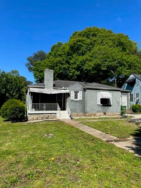 1345 Westridge Road Southwest Atlanta, GA 30311 - Photo 1 of 1 a view of a house with a yard