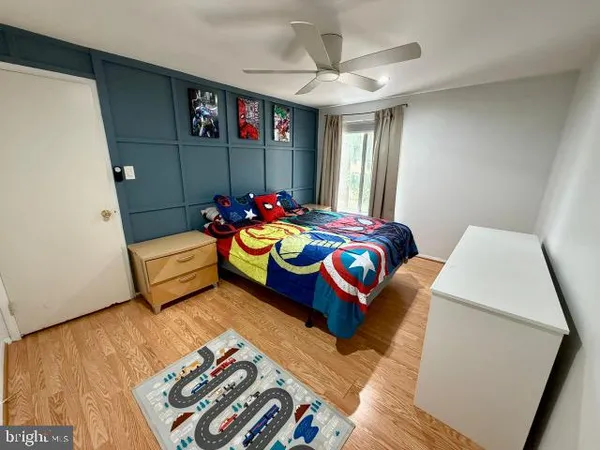 a bedroom with bed and a window