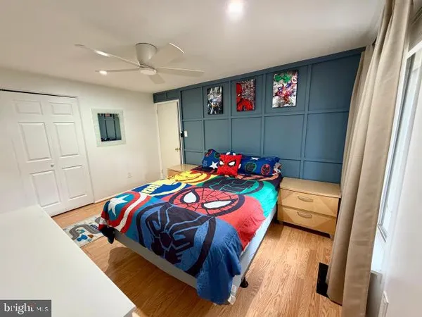 a bedroom with a bed and a dresser