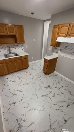 a bathroom with a tub sink and mirror
