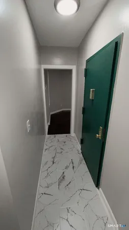 a bedroom with a bed and a mirror