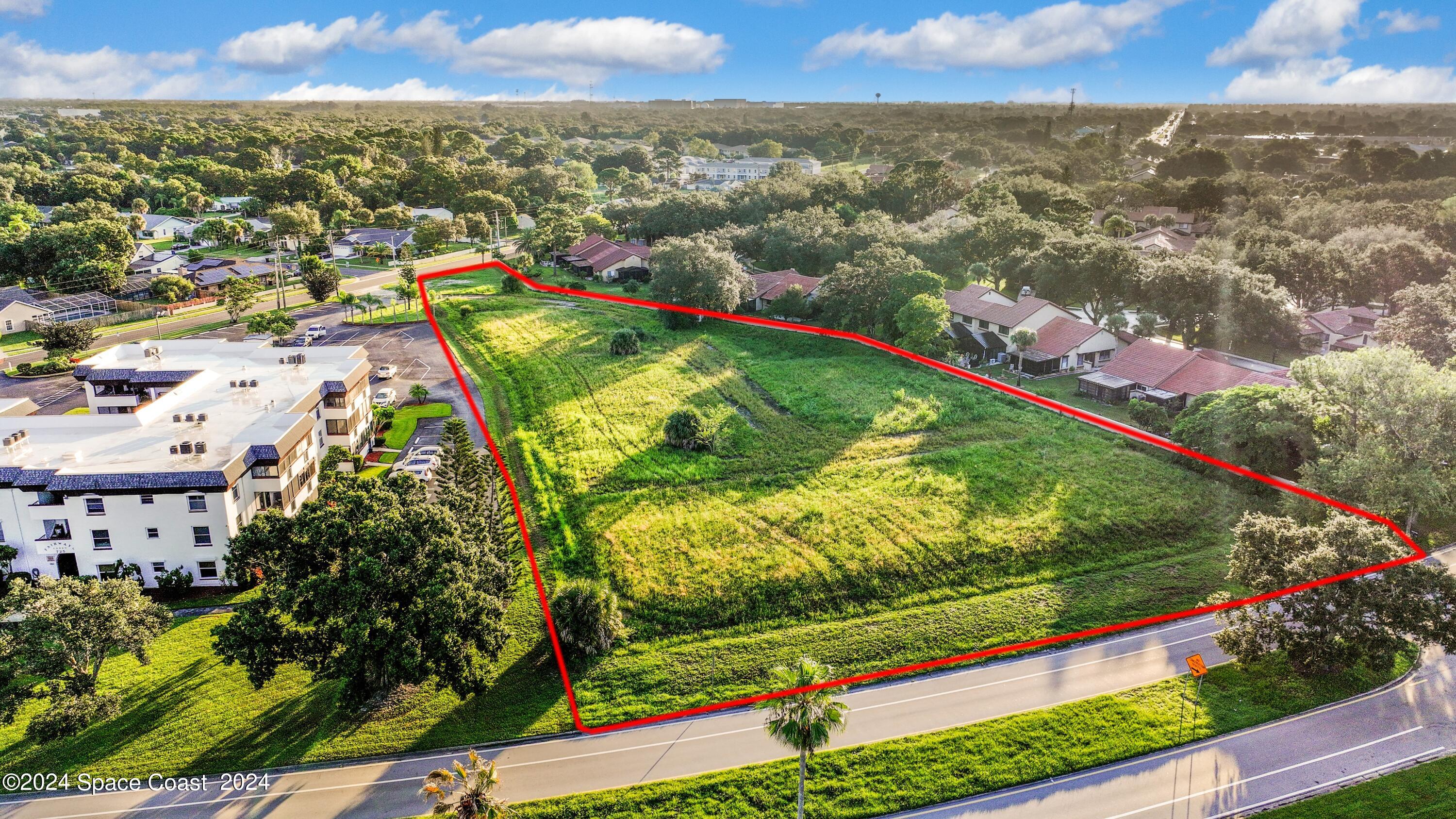 1460 Par Street Northeast Palm Bay, FL 32905 - Photo 1 of 16 an aerial view of residential houses with outdoor space and trees