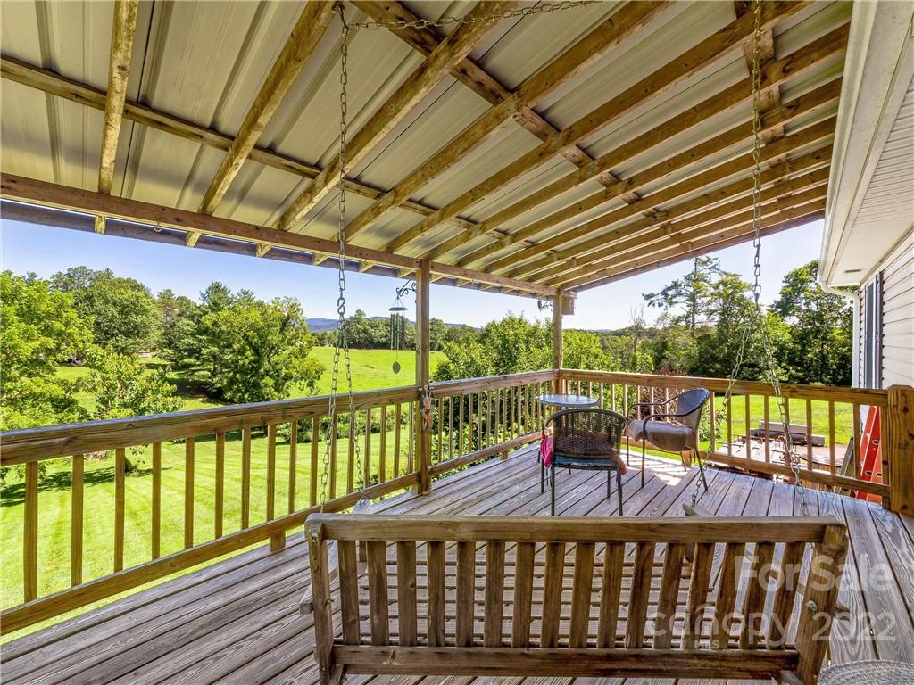 4411 Eller Ford Road Weaverville, NC 28787 - Photo 18 of 20 a view of a chairs and table in the balcony